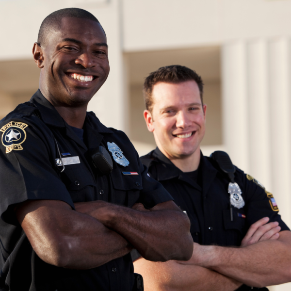 two smiling police officers